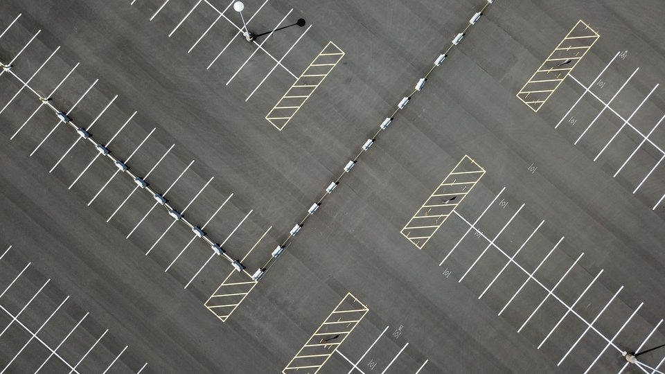Overhead view of a freshly striped asphalt parking lot